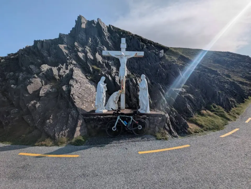 A bike below the white Calvary statues at Slea Head