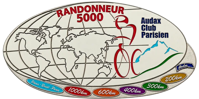 The ACP Randonneur 5000 medal, an oval with the world map and the ride distances along its rim